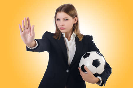 Businesswoman with ball on whiteの写真素材