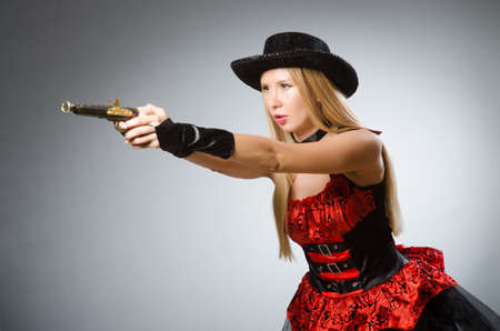 Woman pirate with gun wearing hatの写真素材