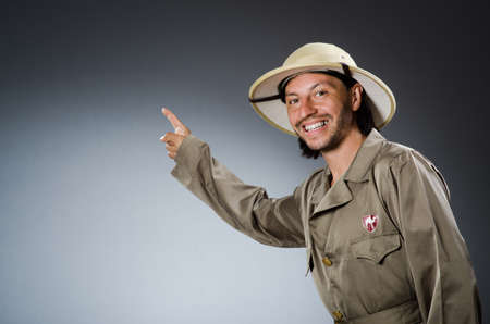 Funny safari hunter against background