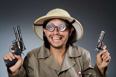 Funny safari hunter against background