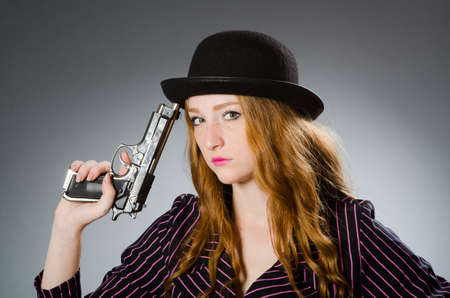 Woman gangster with gun in vintage conceptの写真素材
