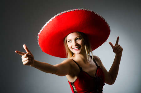 Woman wearing sombrero hat in funny conceptの写真素材