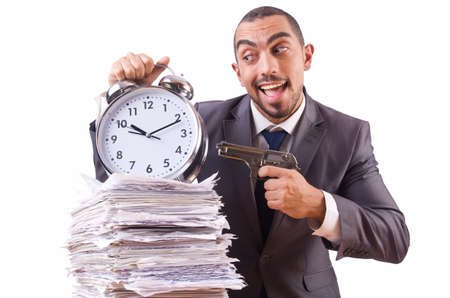 Angry businessman with stack of papersの写真素材