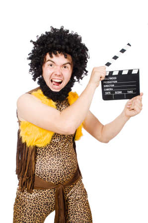 Cave man with movie board isolated on whiteの写真素材