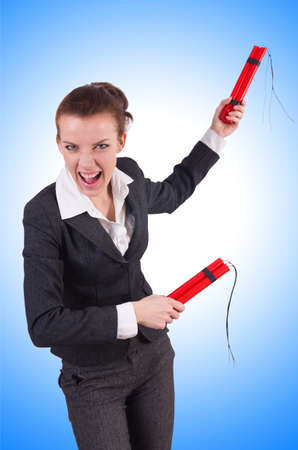 Businesswoman with dynamite on whiteの写真素材