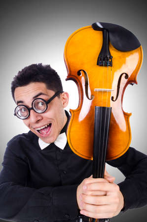 Funny man with violin on whiteの写真素材