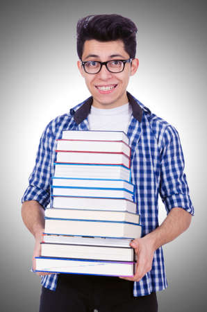 Student with lots of books on whiteの写真素材