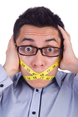 Man with centimeter in dieting conceptの写真素材