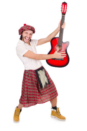 Scotsman playing guitar isolated on whiteの写真素材