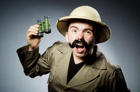 Man in safari hat in hunting concept