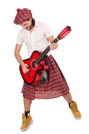 Scotsman playing guitar isolated on whiteの写真素材