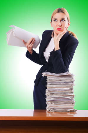 Woman businesswoman with lots of papersの写真素材