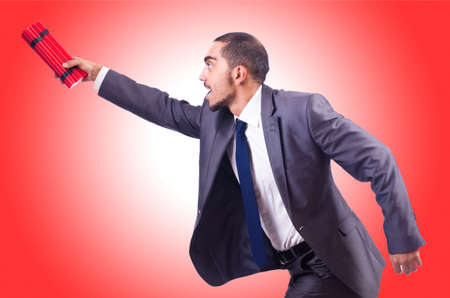 Businessman with dynamite isolated on whiteの写真素材