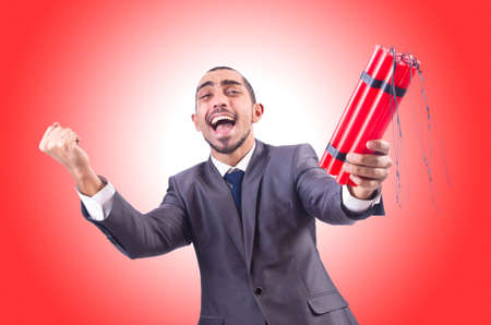 Businessman with dynamite isolated on whiteの写真素材