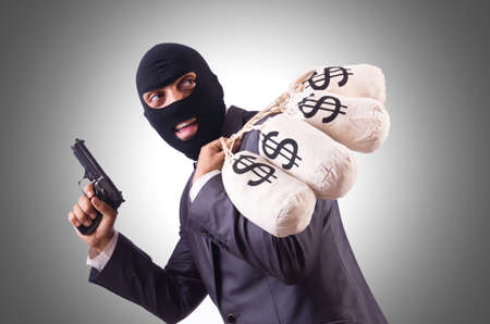 Gangster with bags of money on white
