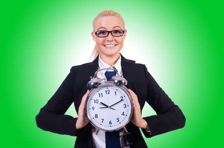 Woman with giant clock on whiteの写真素材
