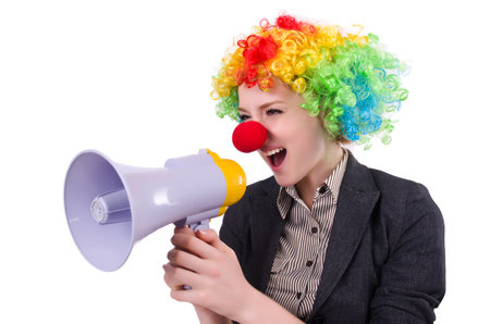 Businesswoman clown with loudspeaker isolated on whiteの写真素材