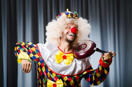 Angry clown with frying panの写真素材