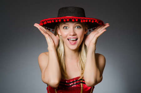 Woman wearing sombrero hat in funny conceptの写真素材