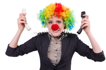 Businessman with clown wig isolated on whiteの写真素材