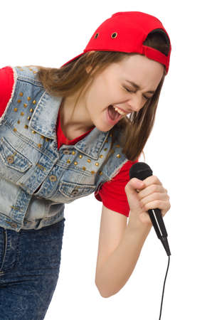 Pretty girl sings karaoke isolated on whiteの写真素材