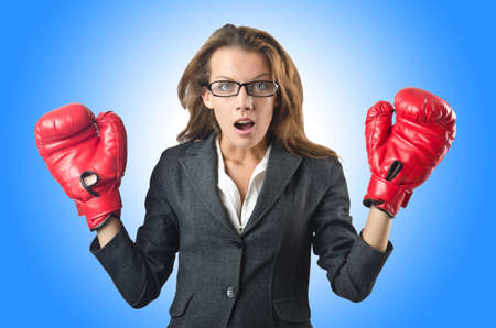 Young businesswoman in boxing conceptの写真素材