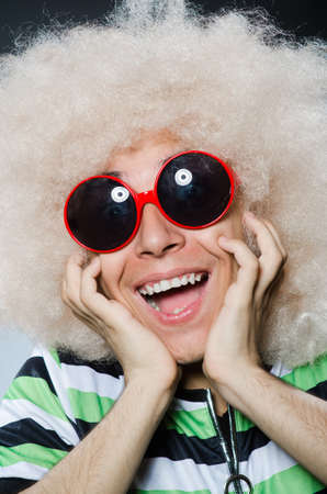 Funny man with afro hairstyle isolated on whiteの写真素材