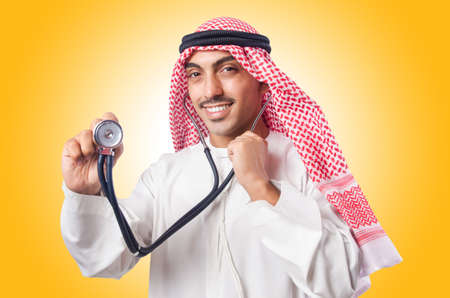 Arab doctor with stethoscope on whiteの写真素材