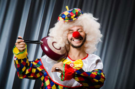 Angry clown with frying panの写真素材