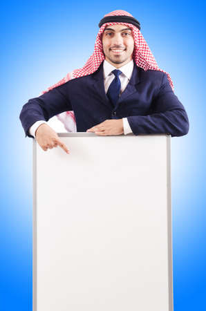 Arab man with blank board for messageの写真素材