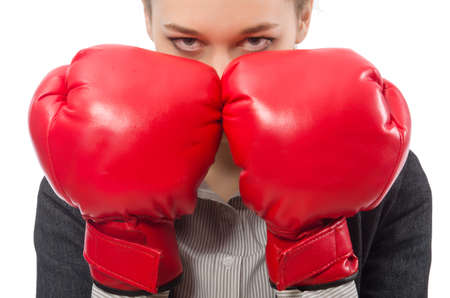 Businesswoman with boxing gloves isolated on whiteの写真素材