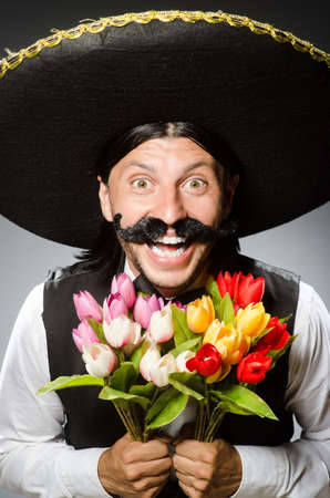 Mexican man wears sombrero isolated on whiteの写真素材