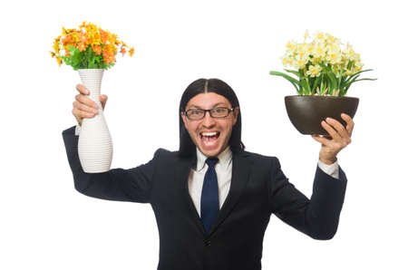Handsome businessman with flower pot isolated on whiteの写真素材
