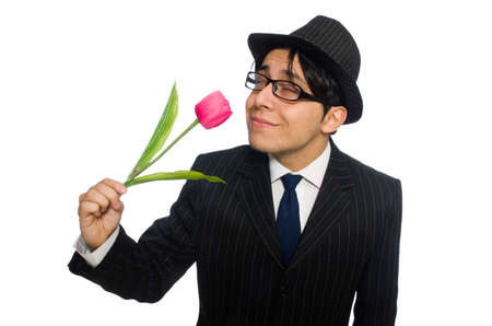 Young man in black costume with flower isolated on whiteの写真素材