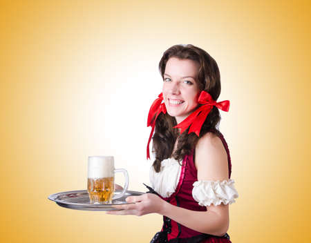 Bavarian girl with tray on whiteの写真素材