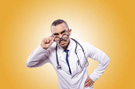 Funny doctor isolated on the whiteの写真素材