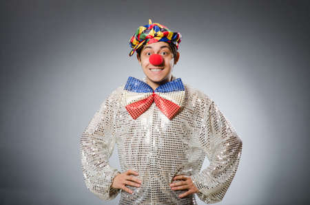 Funny clown against dark backgroundの写真素材