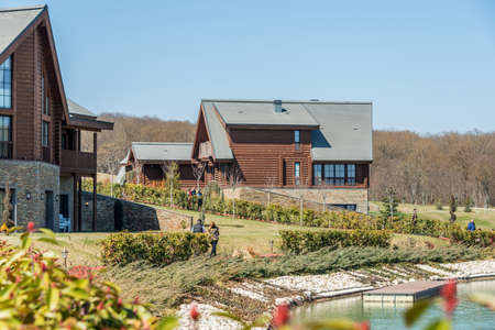 Modern house near water on bright dayのeditorial素材