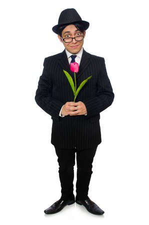 Young man in black costume with flower isolated on whiteの写真素材