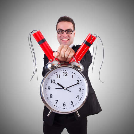 Man with time bomb isolated on whiteの写真素材
