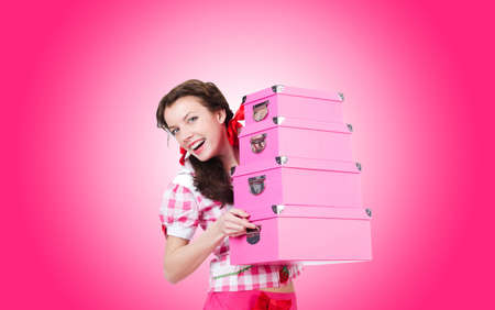 Young woman with storage boxes on whiteの写真素材