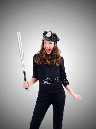 Police with bat isolated on whiteの写真素材