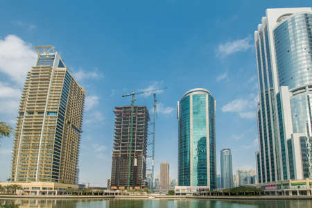 Tall skyscrapers in Dubai near waterのeditorial素材