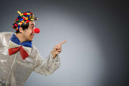 Funny clown against dark background