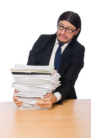 Businessman overwhelmed and stressed from paperworkの写真素材