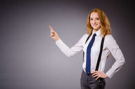 Pretty girl wearing black and white clothing isolated on grayの写真素材