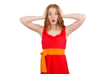 Pretty young girl in red dress isolated on whiteの写真素材