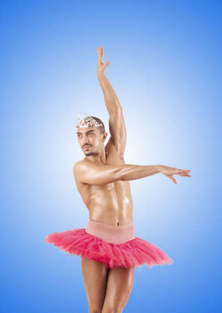 Man in ballet tutu against the gradientの写真素材
