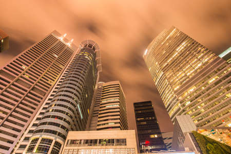 Singapore - AUGUST 4, 2014: Office buildings on August 4 in Singapore, Singapore. Singapore is home to many international businessesのeditorial素材