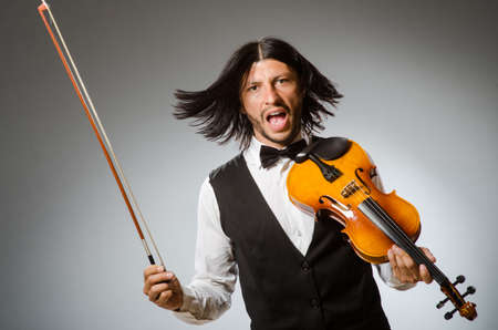 Man playing violin in musical conceptの写真素材